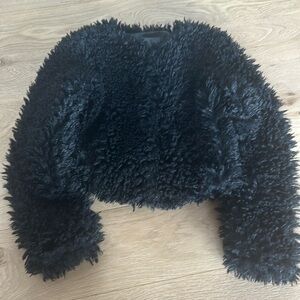 Ugg Women’s cropped fuzzy black coat. Size Large.